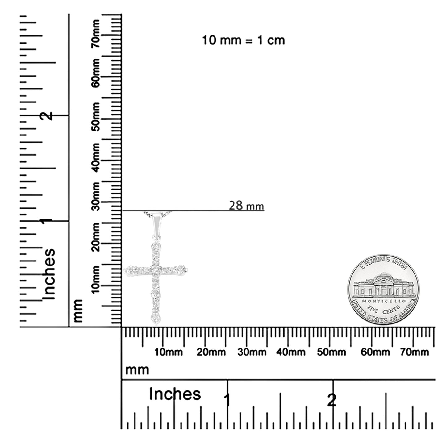 White metal cross pendant necklace with round white gemstones in prong settings, shown hanging against intersecting rulers and a coin for size reference, photographed from the front.