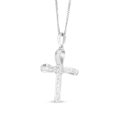Front-facing shot of a white cross-shaped necklace pendant featuring round prong-set white gemstones clustered in the center and channel-set baguette white gemstones along the arms, hanging from a chain.