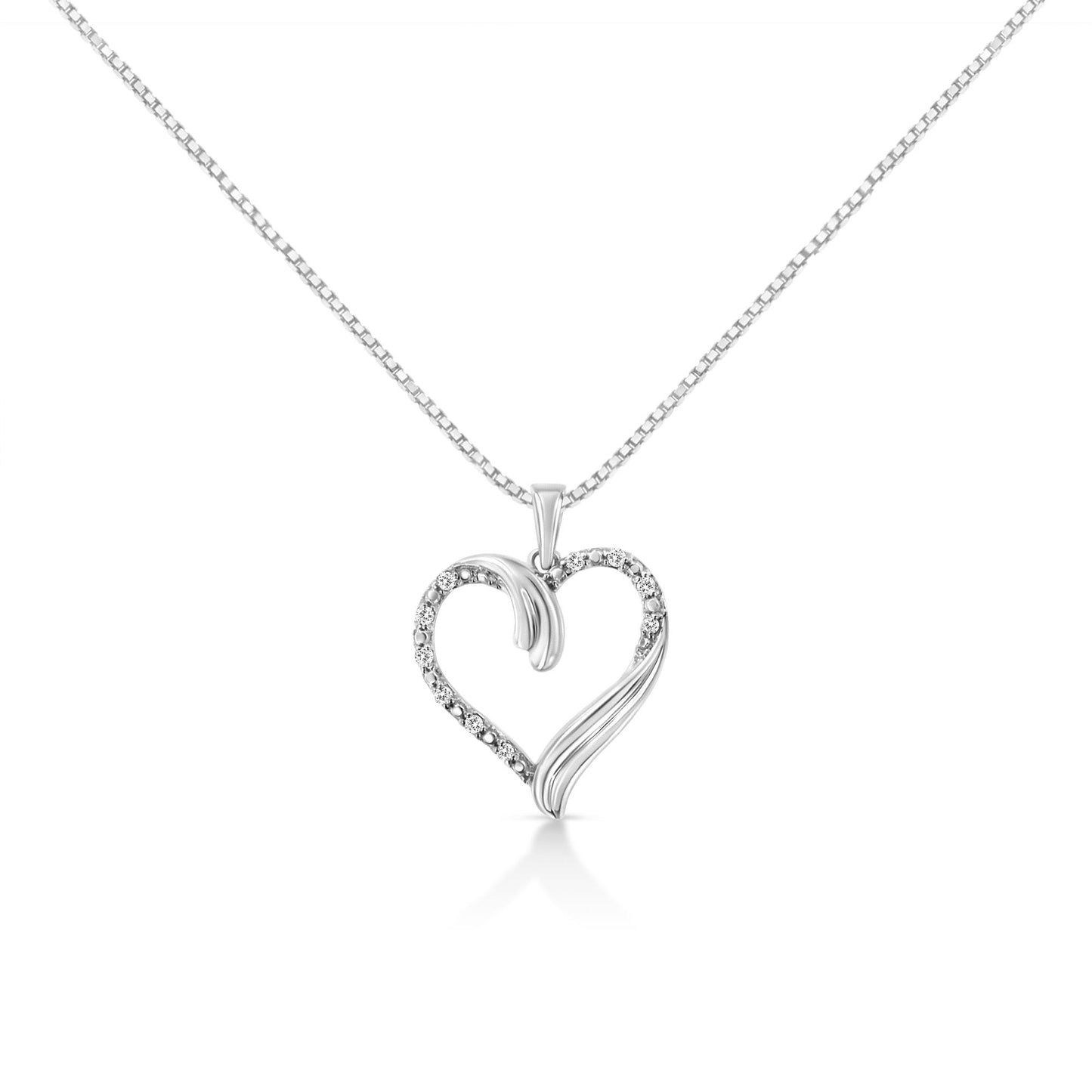 Front view of a white metal heart-shaped necklace pendant with round white gemstones set along one side, captured against a white background.