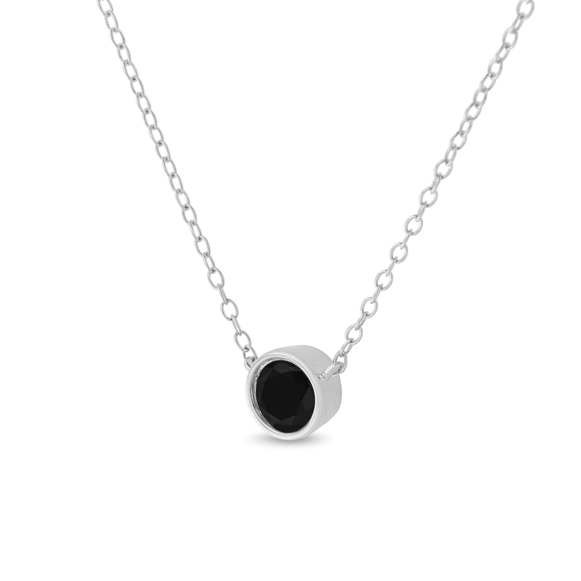 White metal necklace with a round black gemstone in a bezel setting, shown in a front close-up angle.