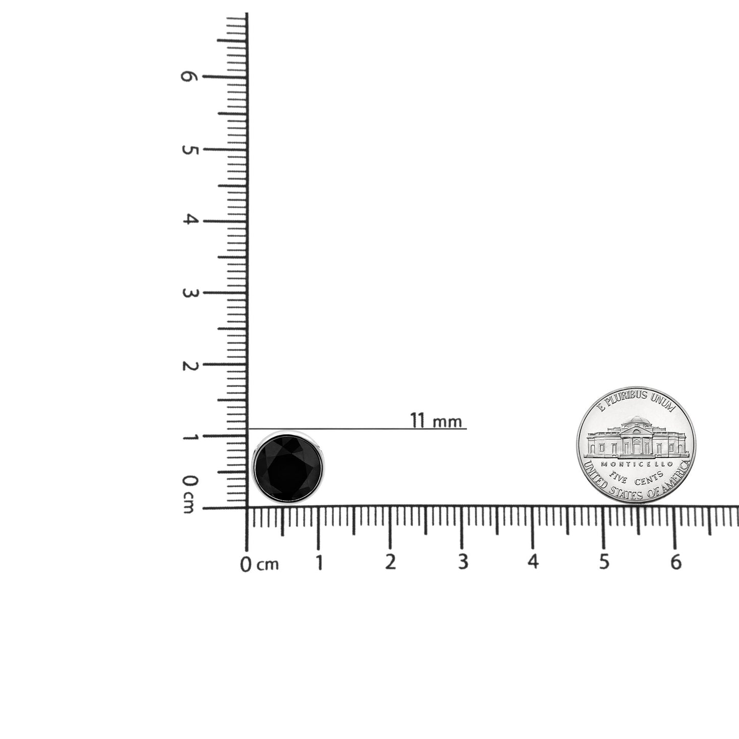 White metal necklace pendant with a round black gemstone in a bezel setting, shown on a ruler for size reference, front angle.