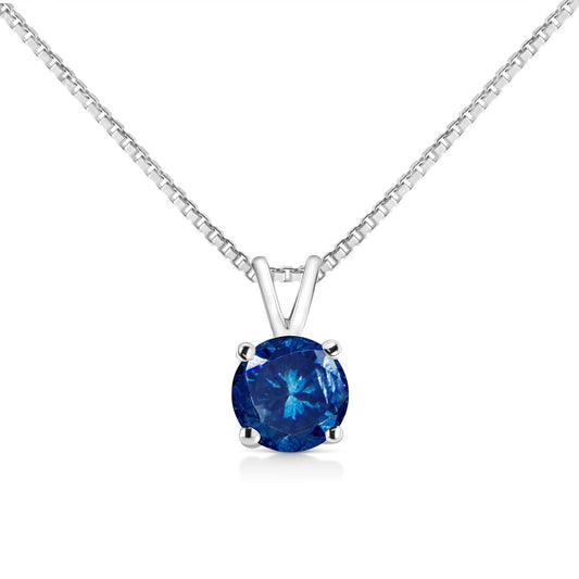 Close-up front view of a white metal necklace with a pendant featuring a round blue gemstone in a prong setting.