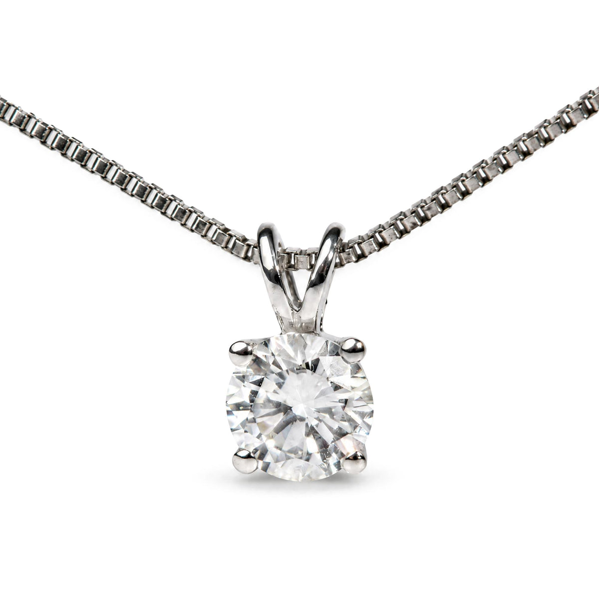 Close-up front view of a white necklace chain with a pendant featuring a single round white gemstone in a four-prong setting.