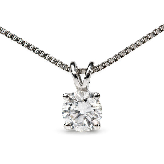 Close-up front view of a white necklace chain with a pendant featuring a single round white gemstone in a four-prong setting.