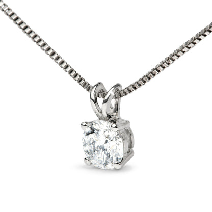 Close-up front angle of a white metal necklace with a round white gemstone set in a four-prong setting.