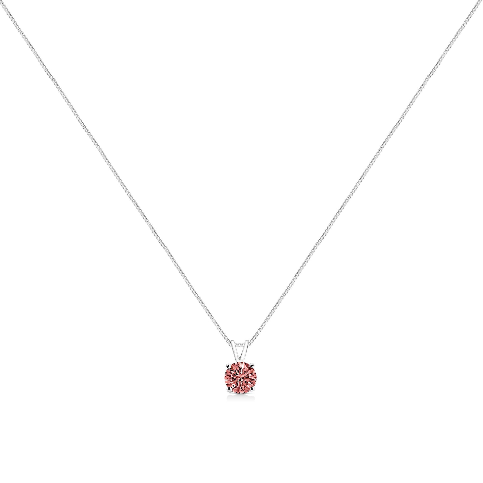 White metal necklace with a prong-set round pink gemstone pendant, front view.