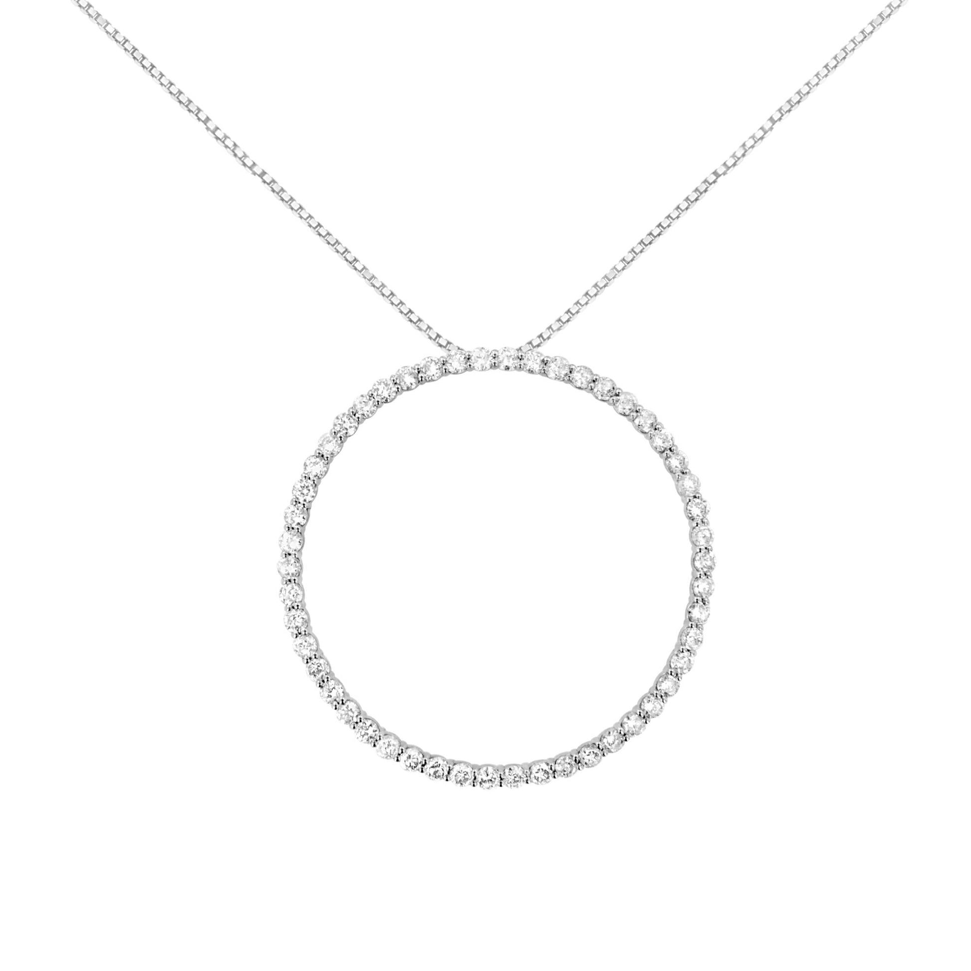 Front-facing shot of a white metal necklace featuring a circular pendant adorned with round white gemstones in prong settings.