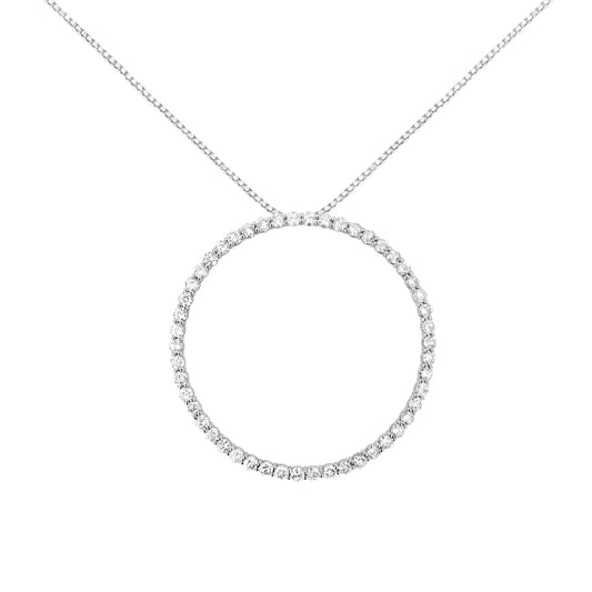 Front-facing shot of a white metal necklace featuring a circular pendant adorned with round white gemstones in prong settings.
