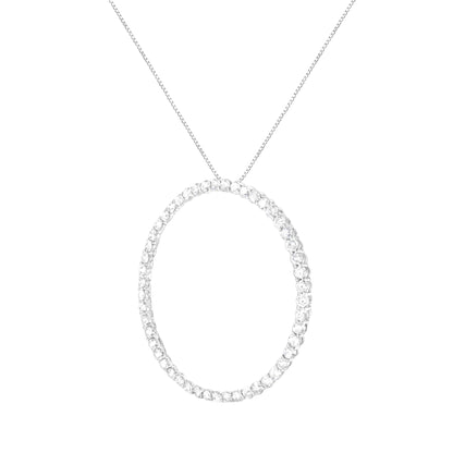 Front-facing shot of a white metal necklace with a round pendant featuring prong-set white round gemstones.