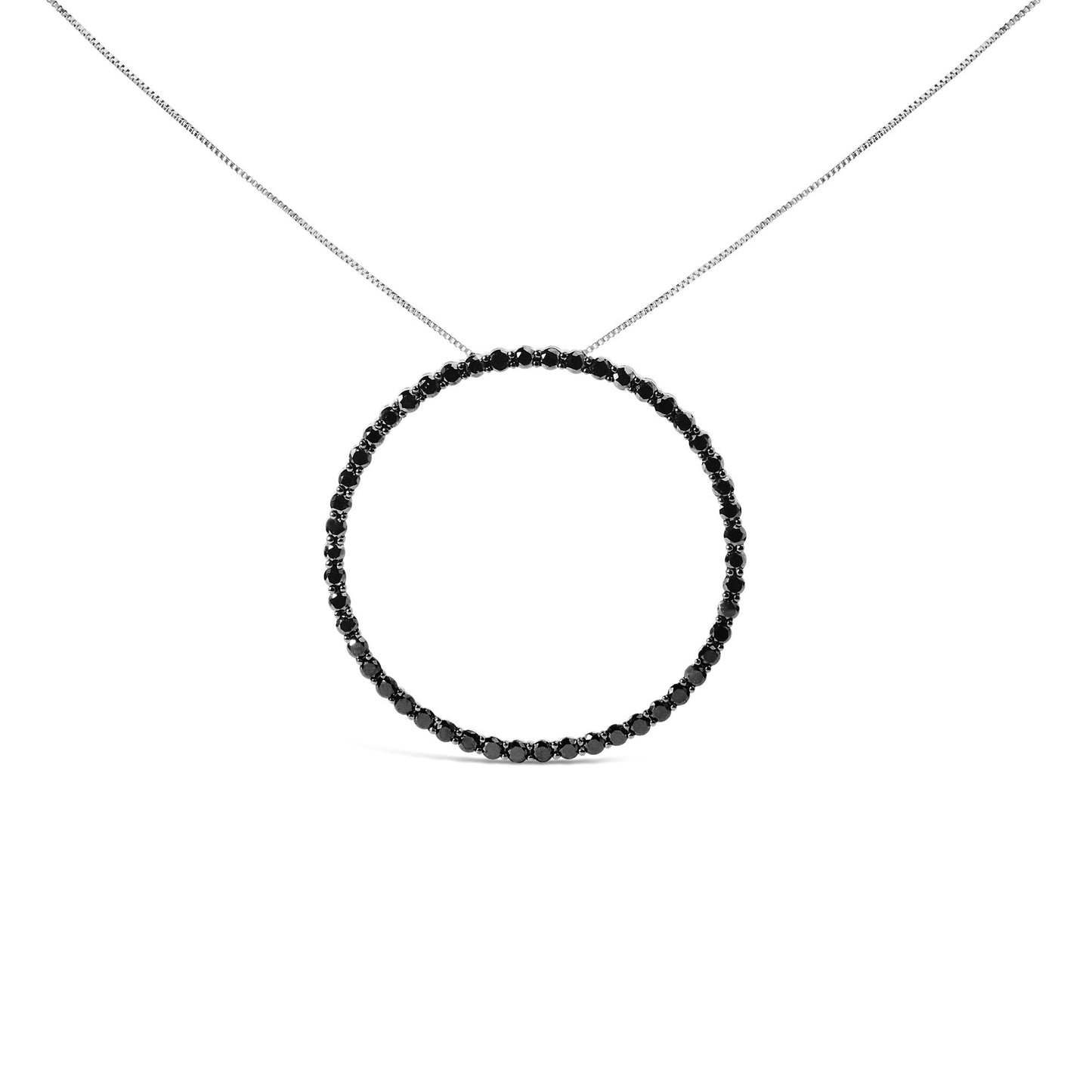 White metal necklace with a circular pendant featuring round black gemstones in a shared prong setting, shown from a front angle.