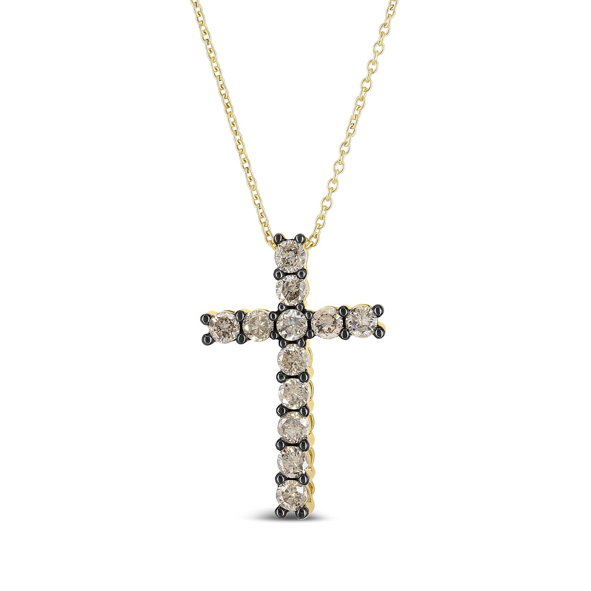 Front-facing close-up of a yellow metal cross necklace with round champagne-colored gemstones in prong settings.