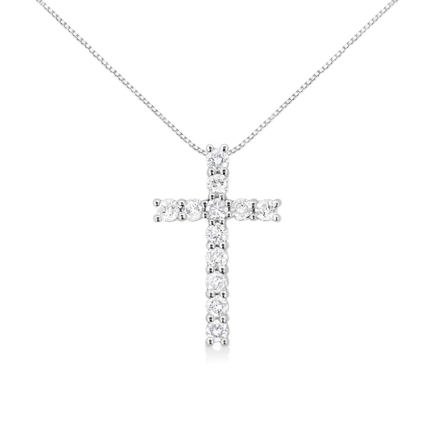 Front angle view of a white metal cross-shaped necklace pendant with round white gemstones in prong settings on a white chain.