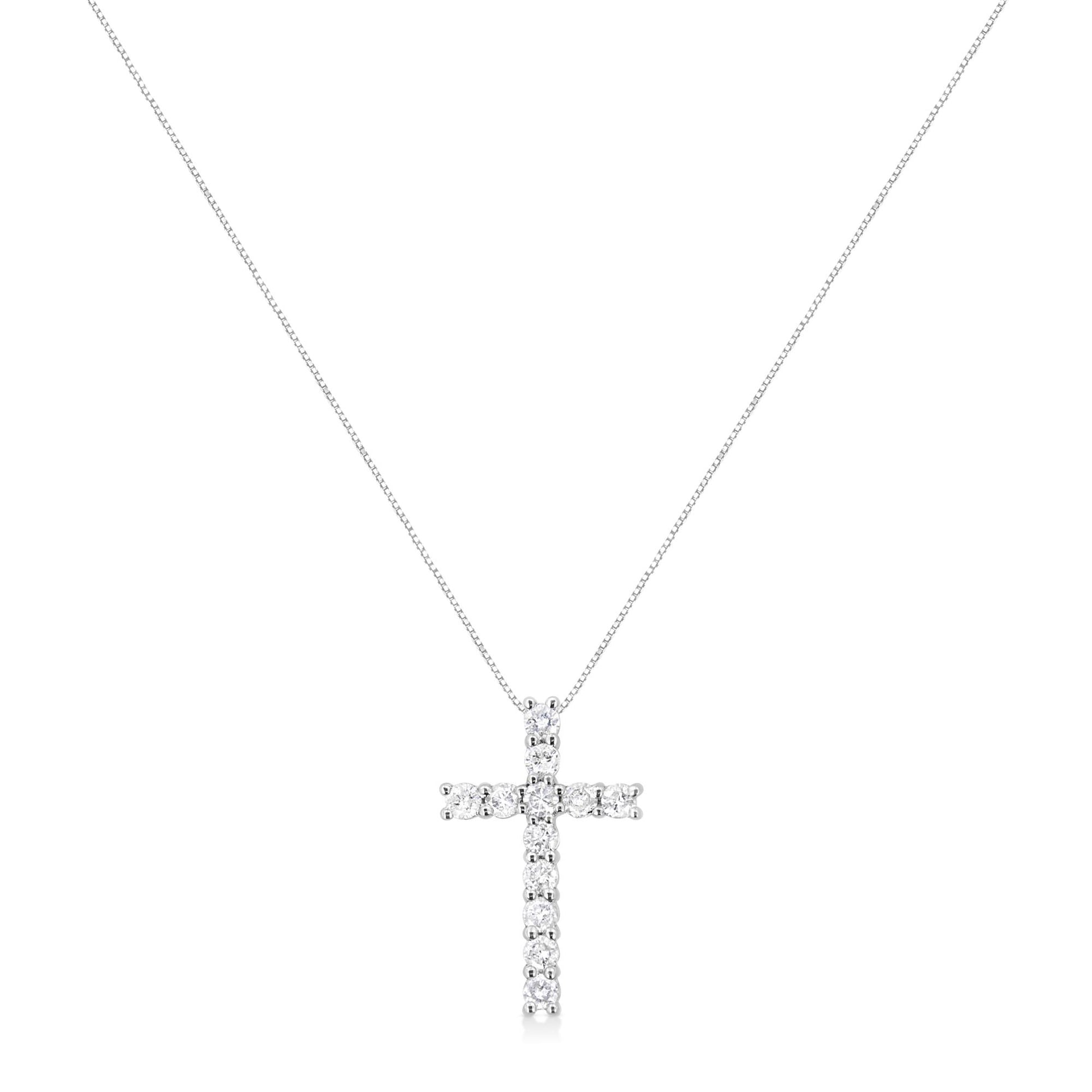 Front view of a white metal necklace with a cross pendant featuring round white gemstones in prong settings.