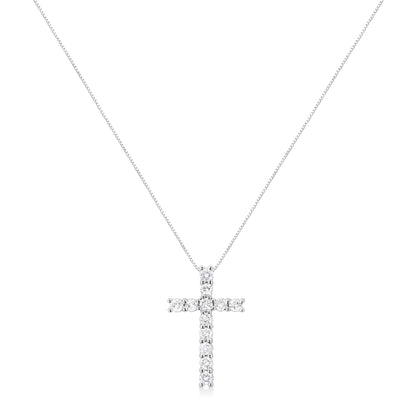Front view of a white metal necklace with a cross pendant featuring round white gemstones in prong settings.