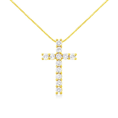 Front view of a yellow metal necklace with a cross pendant featuring round white gemstones in prong settings.