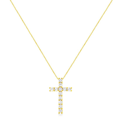 Front-facing view of a yellow metal cross-shaped necklace pendant with round prong-set white gemstones on a thin chain.