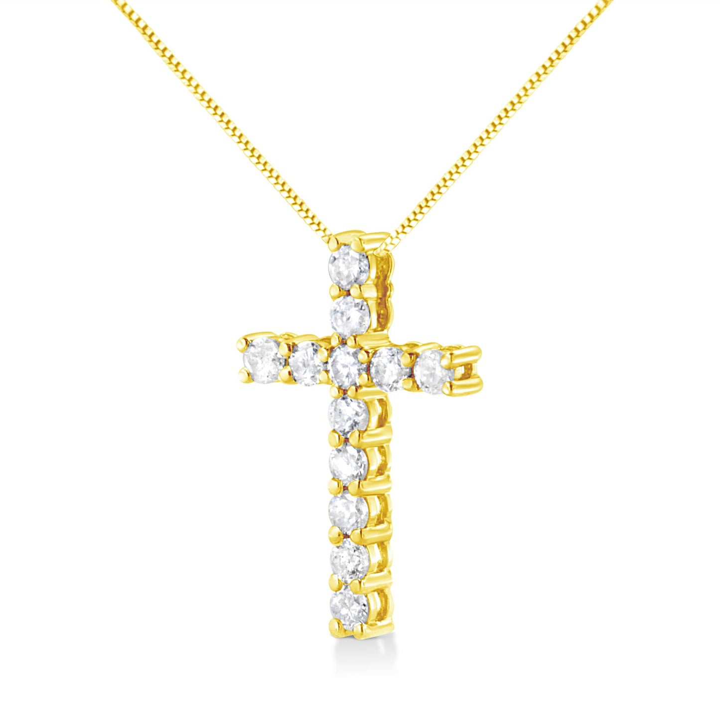Front angled view of a yellow metal cross-shaped necklace pendant set with round white gemstones in prong settings.