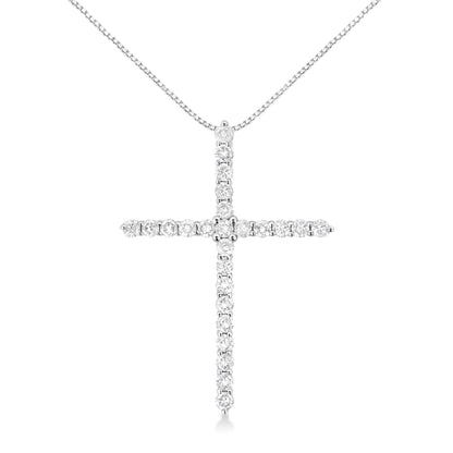Front-facing close-up of a white metal necklace with a cross pendant adorned with round white gemstones in prong settings.