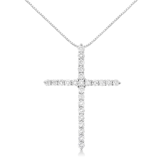 Front-facing close-up of a white metal necklace with a cross pendant adorned with round white gemstones in prong settings.