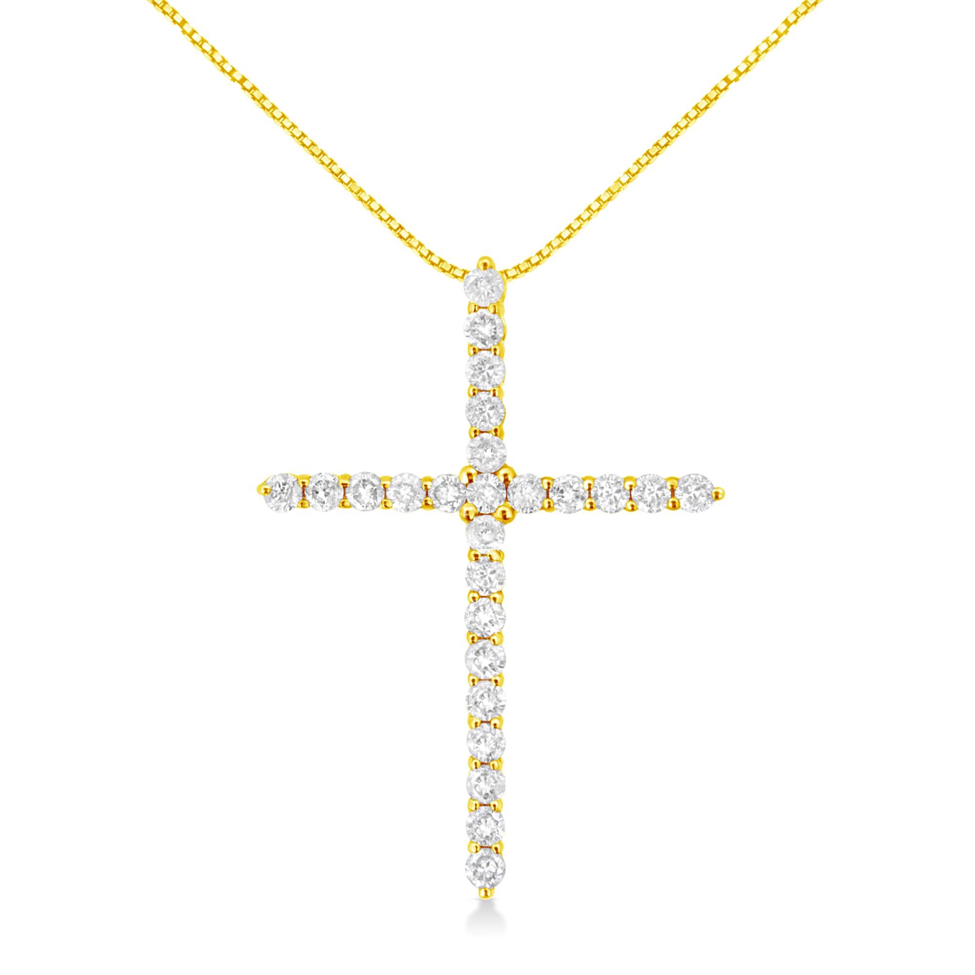 Front view of a yellow metal cross necklace pendant with round white gemstones in prong settings.