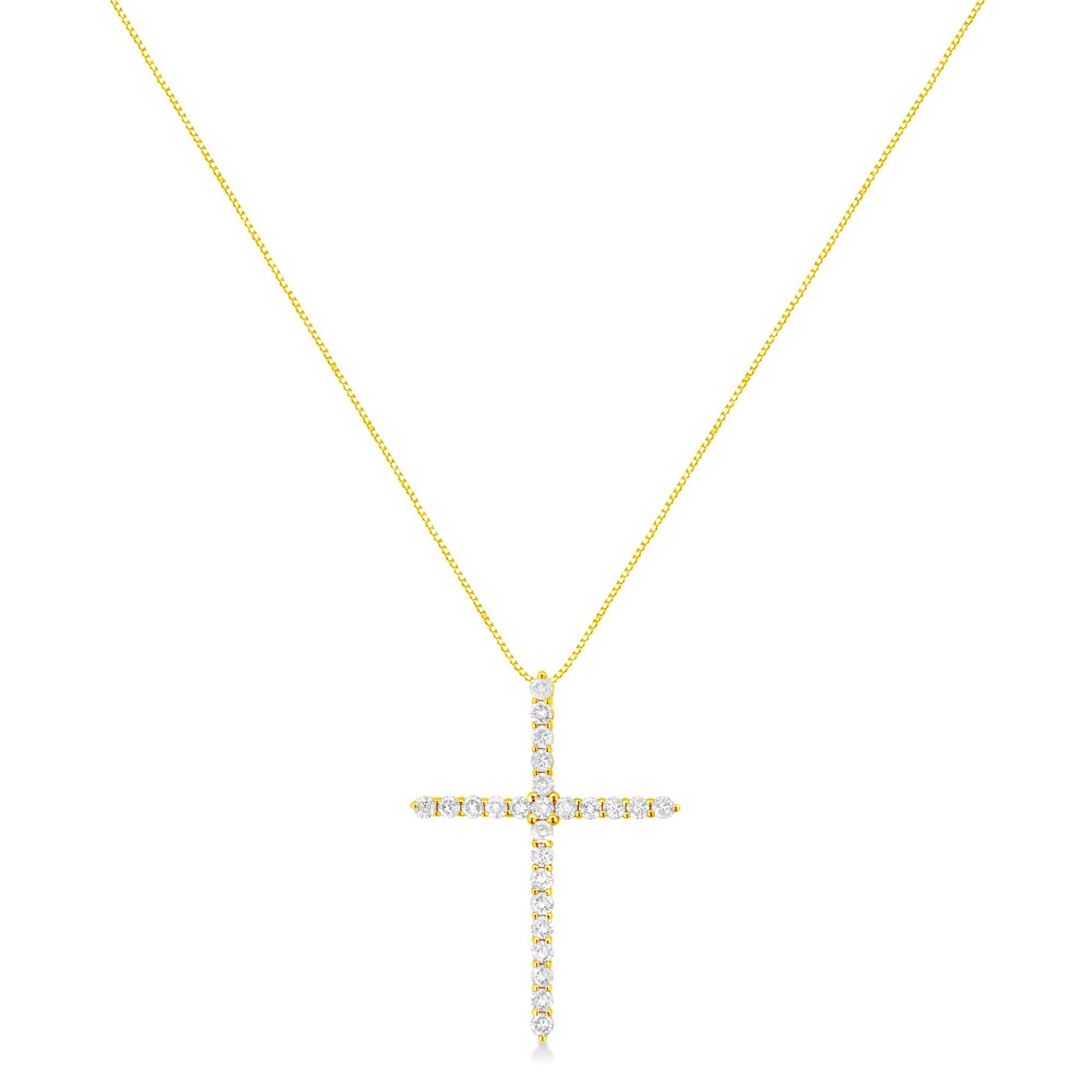 Front-facing view of a yellow metal necklace with a cross-shaped pendant adorned with round white gemstones in prong settings.