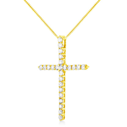 Front-facing close-up of yellow metal cross necklace with round white gemstones in prong settings.