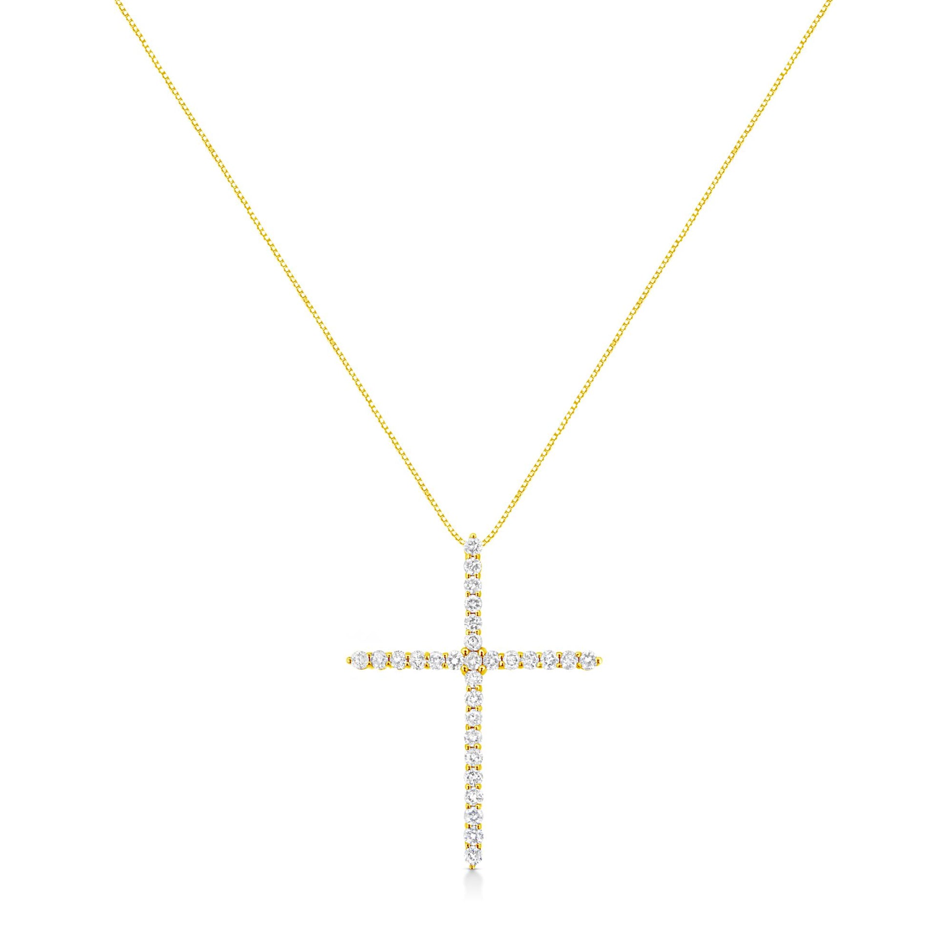 Front view of a yellow metal necklace with a cross-shaped pendant adorned with round white gemstones in prong settings.