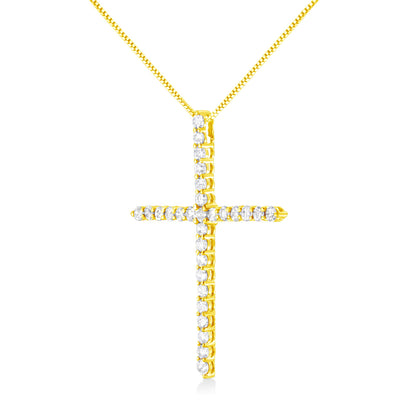 Front view of a yellow metal cross-shaped necklace pendant with white round gemstones in prong settings along the pendant, suspended from a matching yellow chain.
