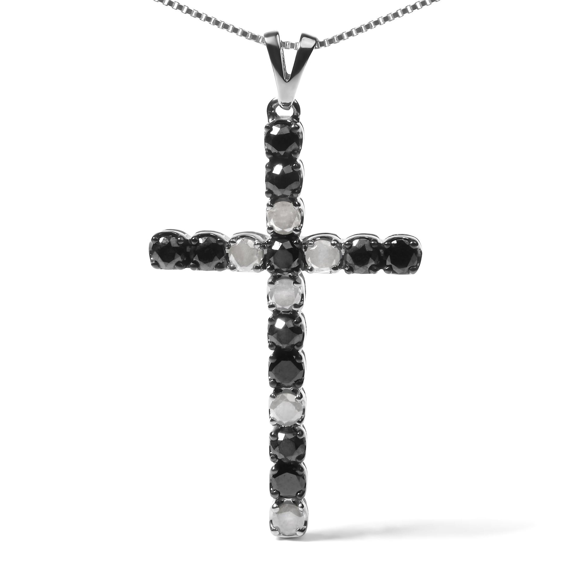 Front-facing shot of a white metal cross pendant necklace with alternating round black and white gemstones in prong settings.