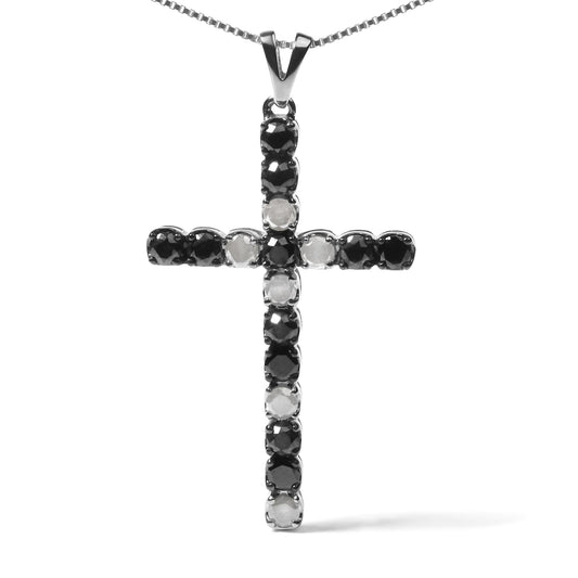 Front-facing shot of a white metal cross pendant necklace with alternating round black and white gemstones in prong settings.