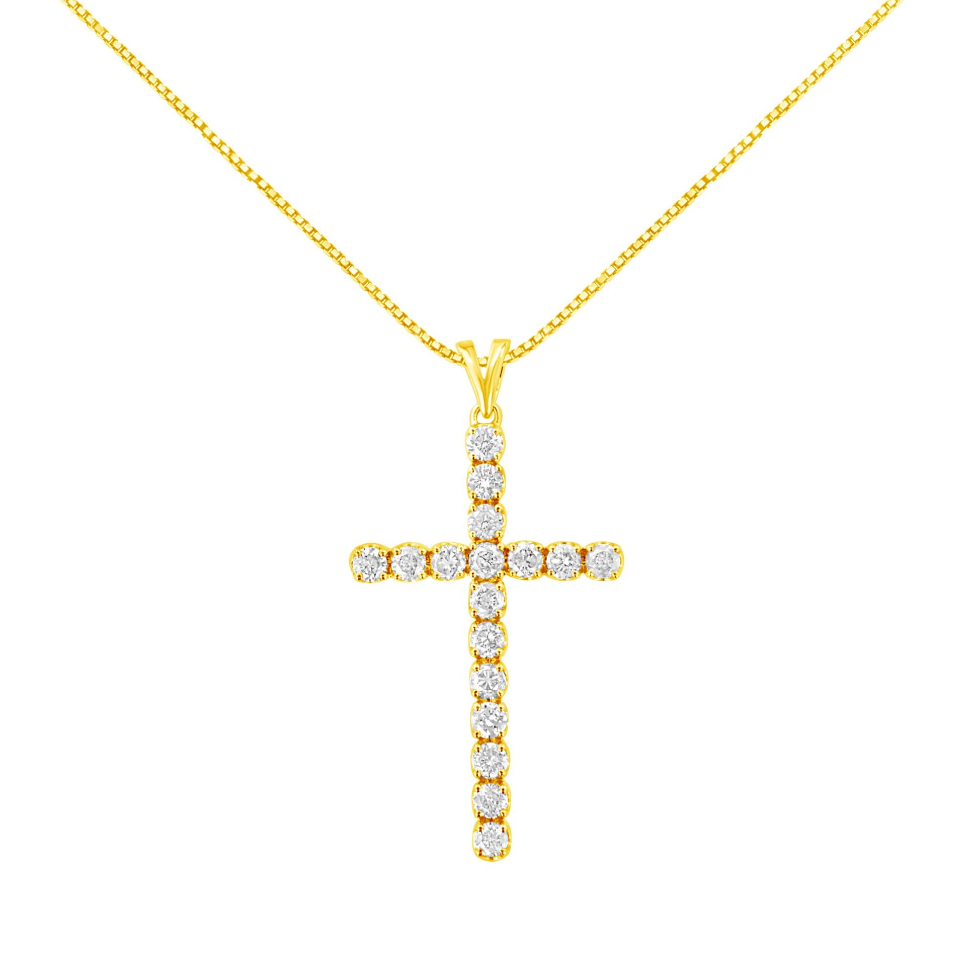 Front-facing shot of a yellow metal cross necklace pendant set with round white gemstones in prong settings on a yellow chain.