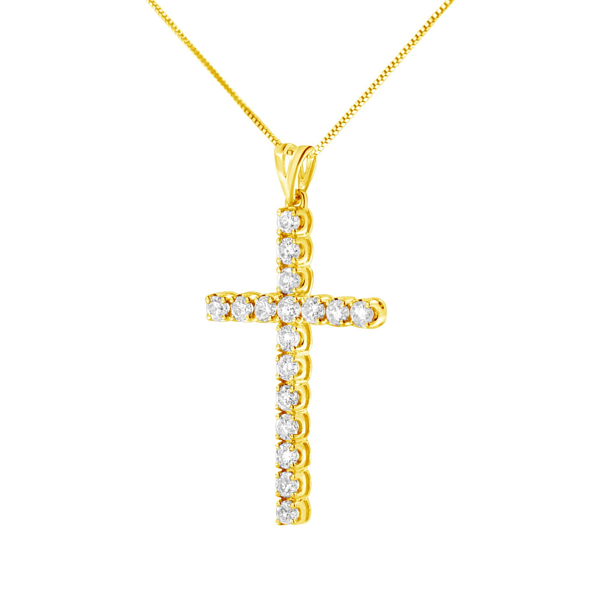 Front-facing shot of a yellow metal cross-shaped necklace pendant with round white gemstones in prong settings, on a matching chain.