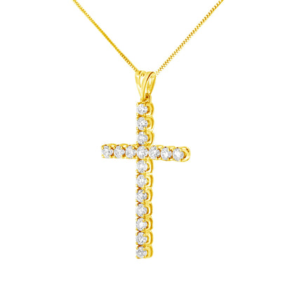 Front-facing shot of a yellow metal cross-shaped necklace pendant with round white gemstones in prong settings, on a matching chain.