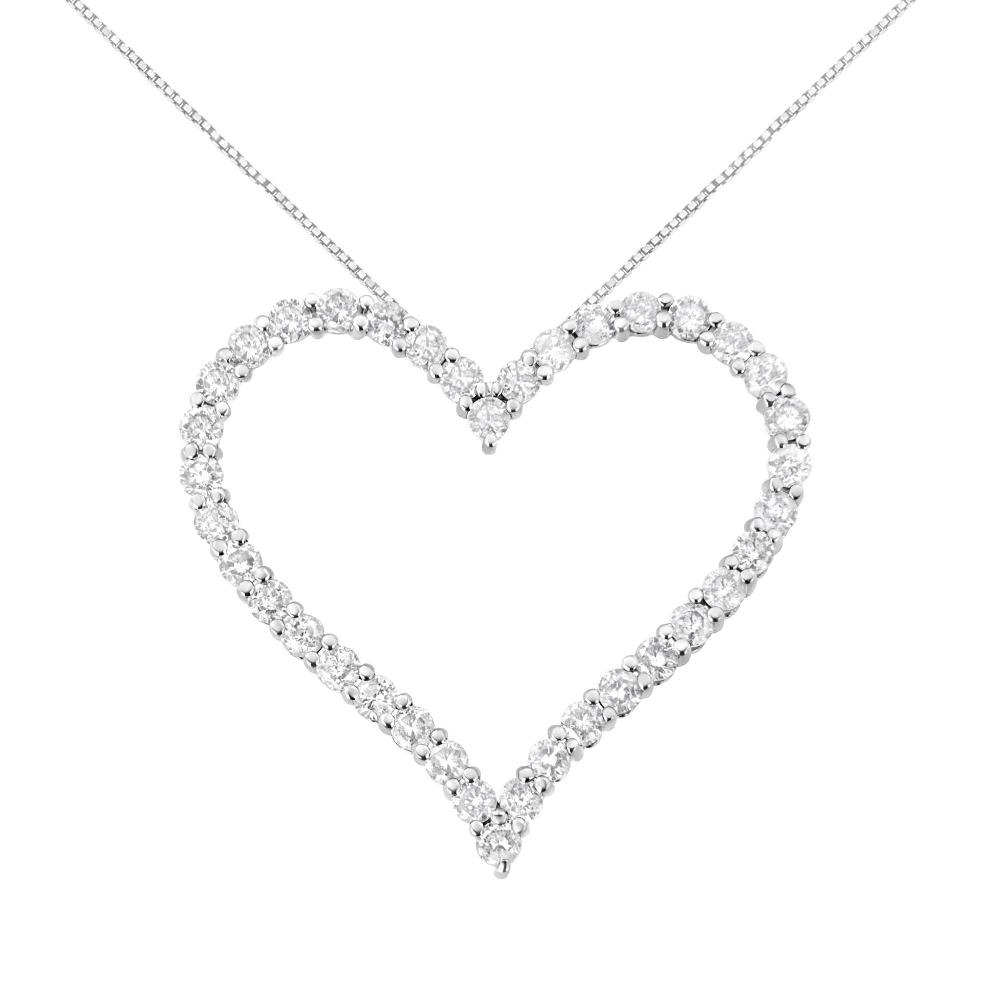 Front view of a white metal heart-shaped necklace pendant featuring round white gemstones in prong settings.