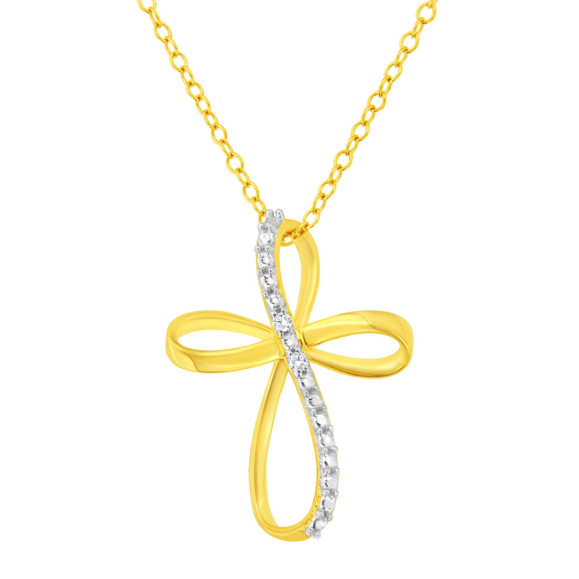 Front view of a yellow metal cross-shaped necklace pendant with a curved line of prong-set white round gemstones on one side, hanging from a matching yellow chain.