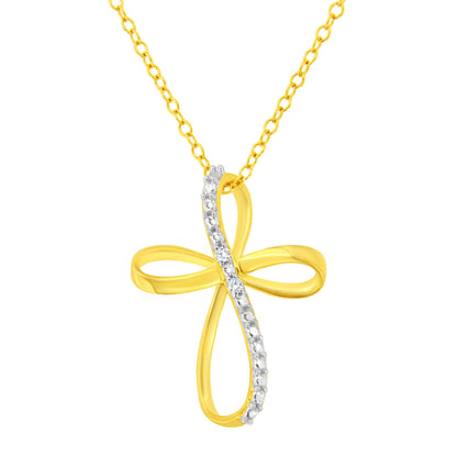 Front view of a yellow metal cross-shaped necklace pendant with a curved line of prong-set white round gemstones on one side, hanging from a matching yellow chain.