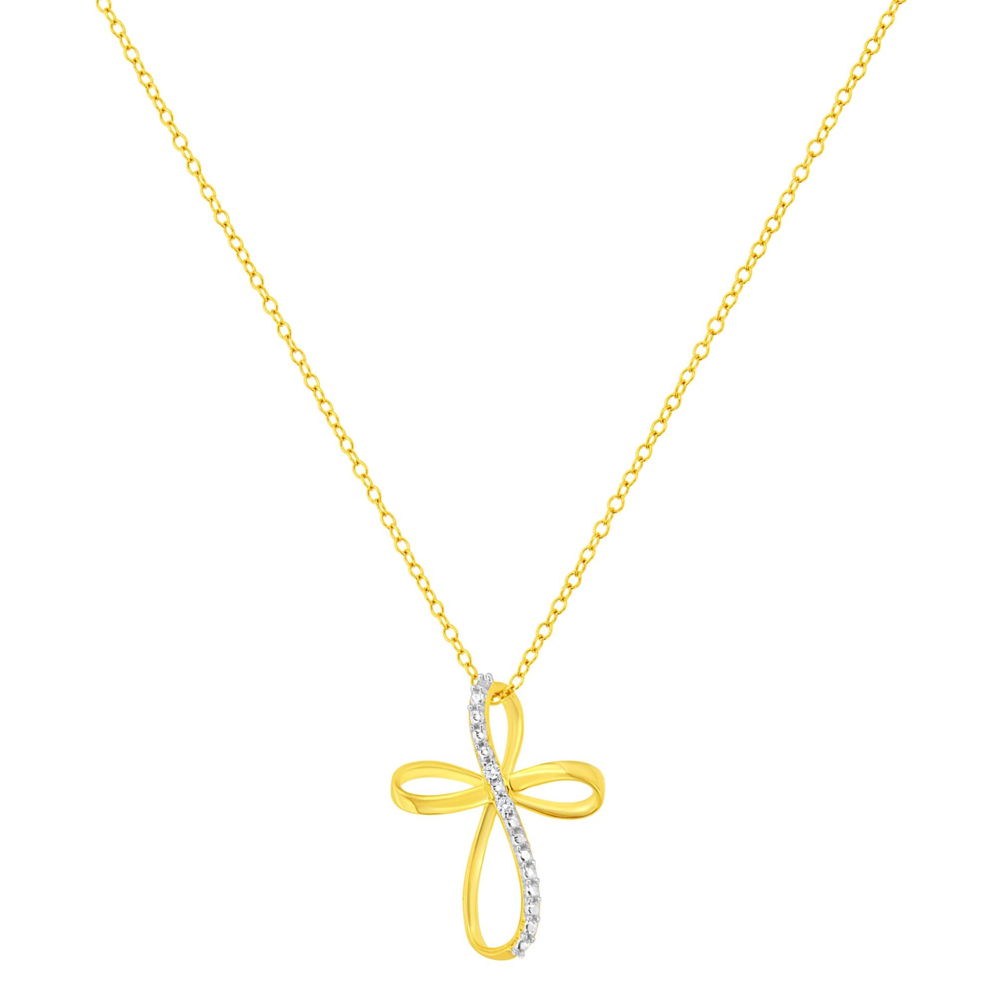 Front-facing view of yellow metal necklace with cross-shaped pendant featuring a curved line of white round gemstones in prong settings.