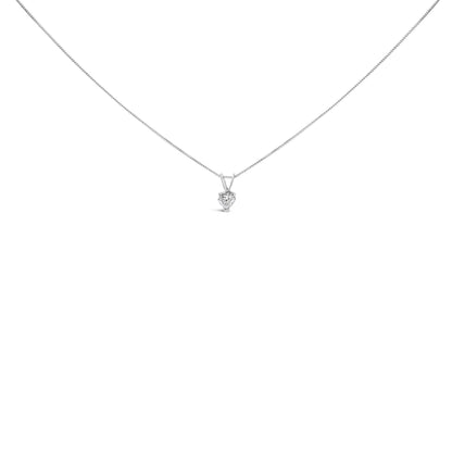 Front-facing shot of a white necklace with a heart-shaped white gemstone pendant in a 3-prong setting.