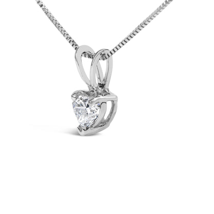 Close-up front angle of a white necklace featuring a heart-shaped pendant with a white gemstone in a 3-prong setting.