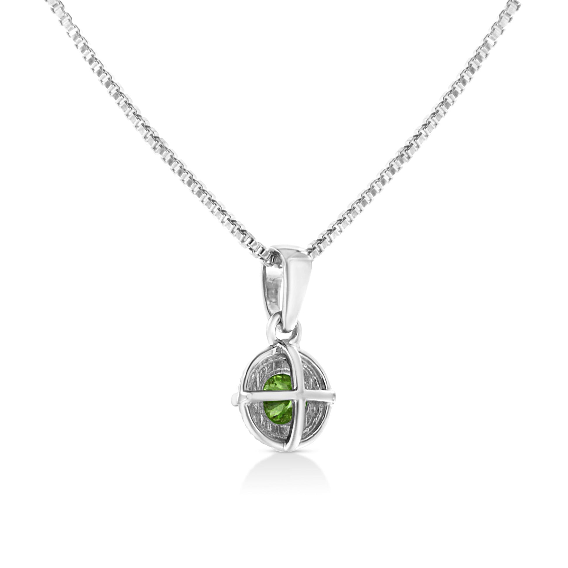 Front-facing shot of a white metal necklace with a round green gemstone pendant in a 4-prong setting.