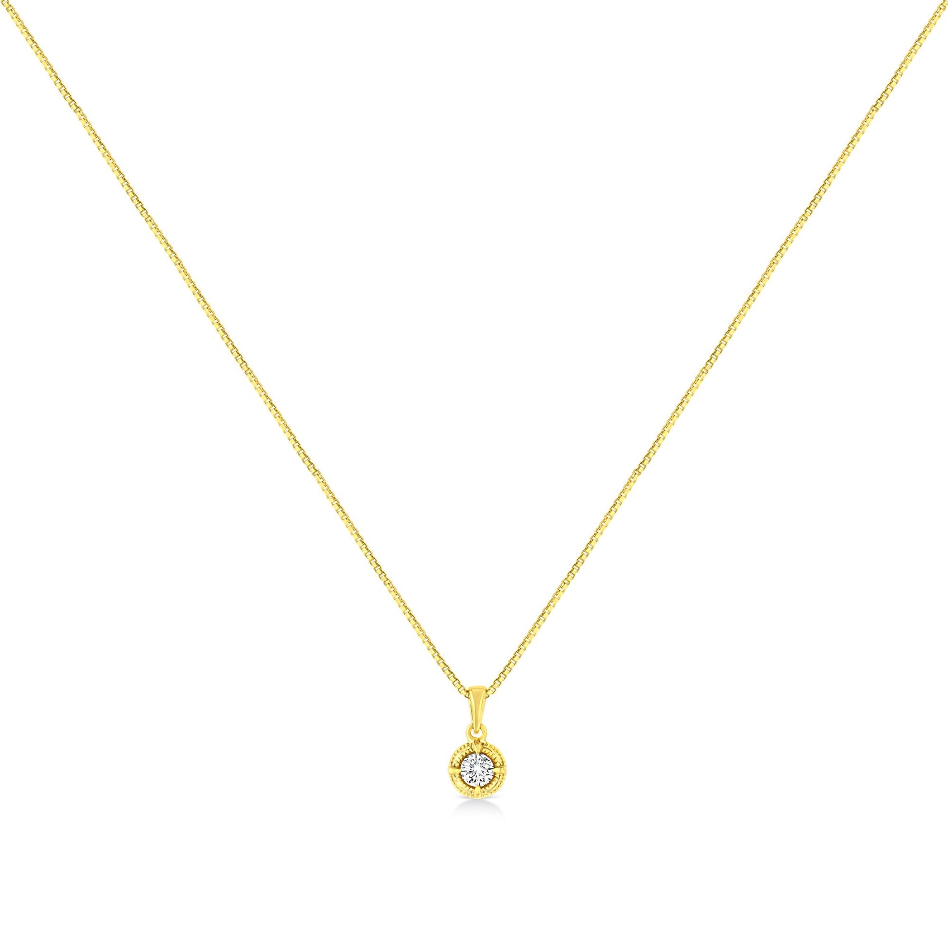 Yellow metal necklace with a small round pendant featuring a single brownish round gemstone in a four-prong setting, shown from the front.