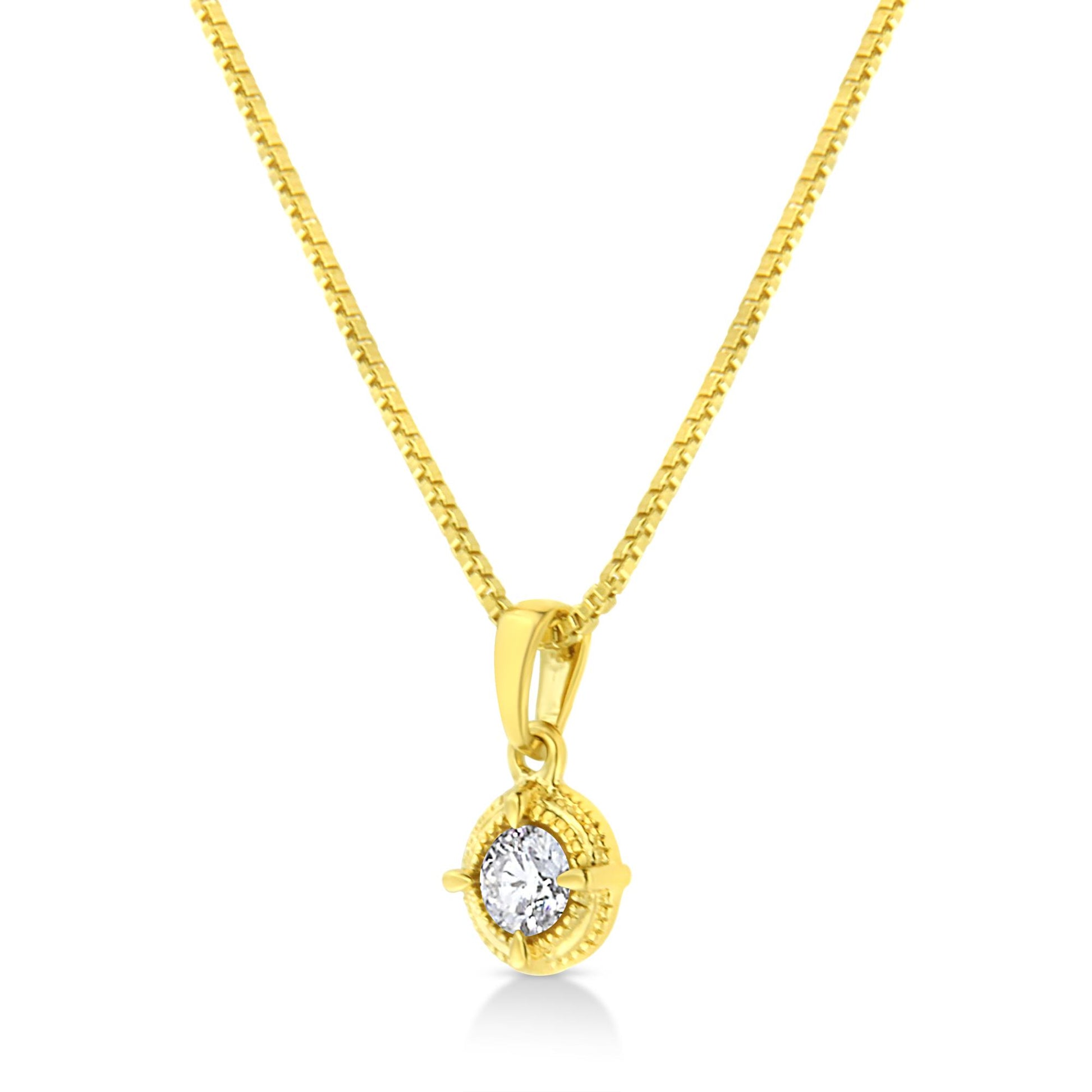 Front angled view of a yellow metal necklace with a round white gemstone in a 4-prong setting pendant.