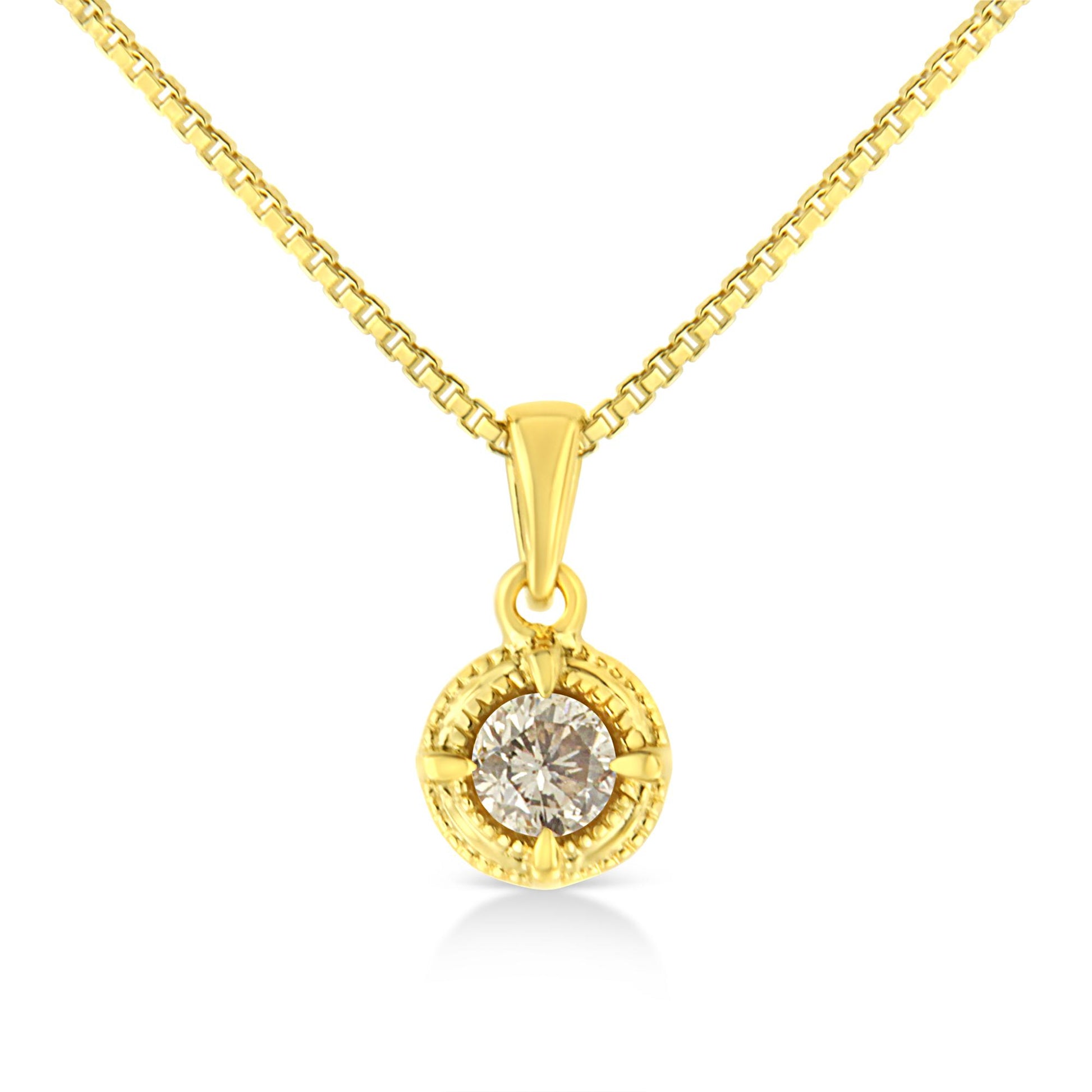 Close-up front view of a yellow metal necklace with a round brownish gemstone in a 4-prong setting pendant.