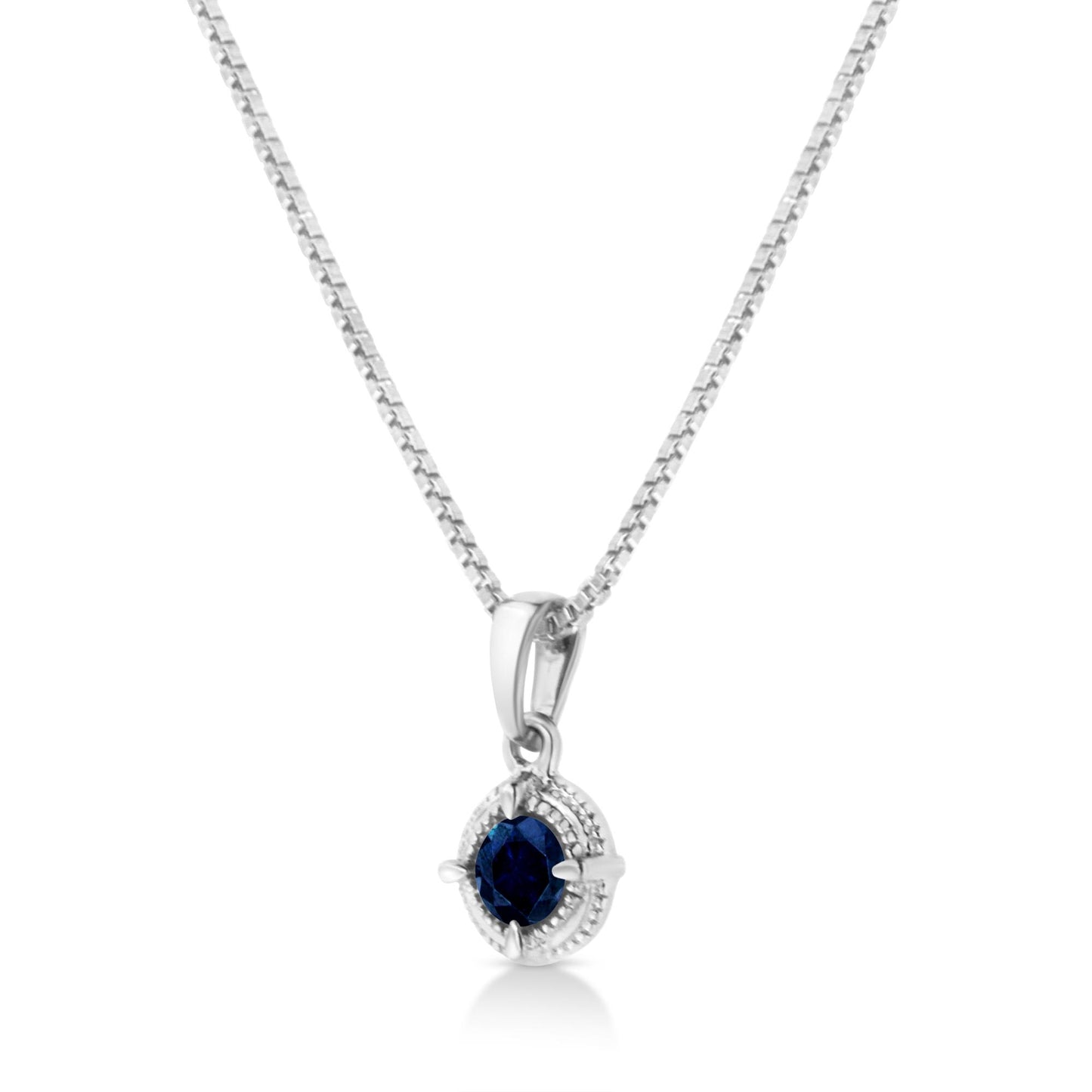 Front-facing view of a white metal necklace with a pendant featuring a round blue gemstone in a 4-prong setting.