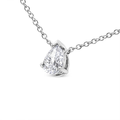 Close-up front angle of a white metal necklace with a pear-shaped white gemstone in a prong setting.