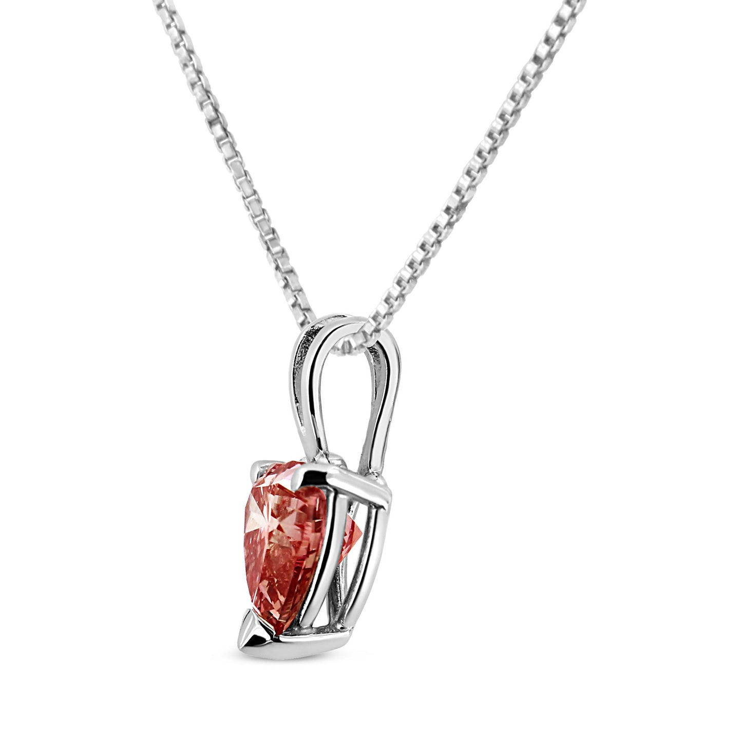 Close-up side angle of a white metal necklace with a heart-shaped pink gemstone pendant in a 3-prong setting.