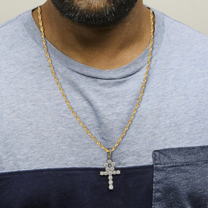 Close-up front view of a model wearing a yellow metal twisted rope necklace with a cross-shaped pendant adorned with white gemstones in prong settings.