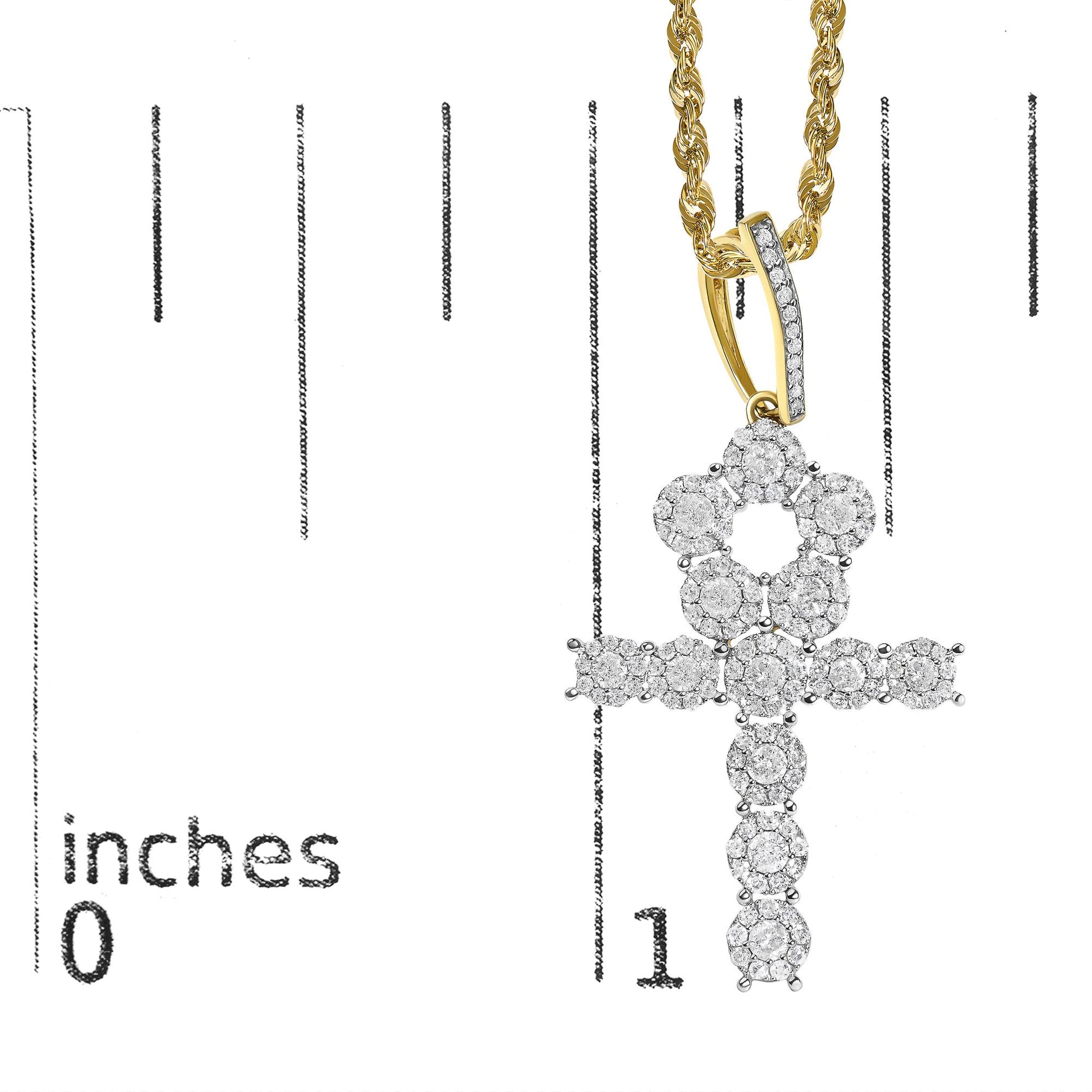 Close-up front view of a yellow metal necklace with intertwined chain links and a pendant featuring clustered round white gemstones in prong settings, shown on a measuring scale.