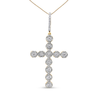 Front-facing shot of a yellow metal cross-shaped necklace pendant with round white gemstones in prong settings.
