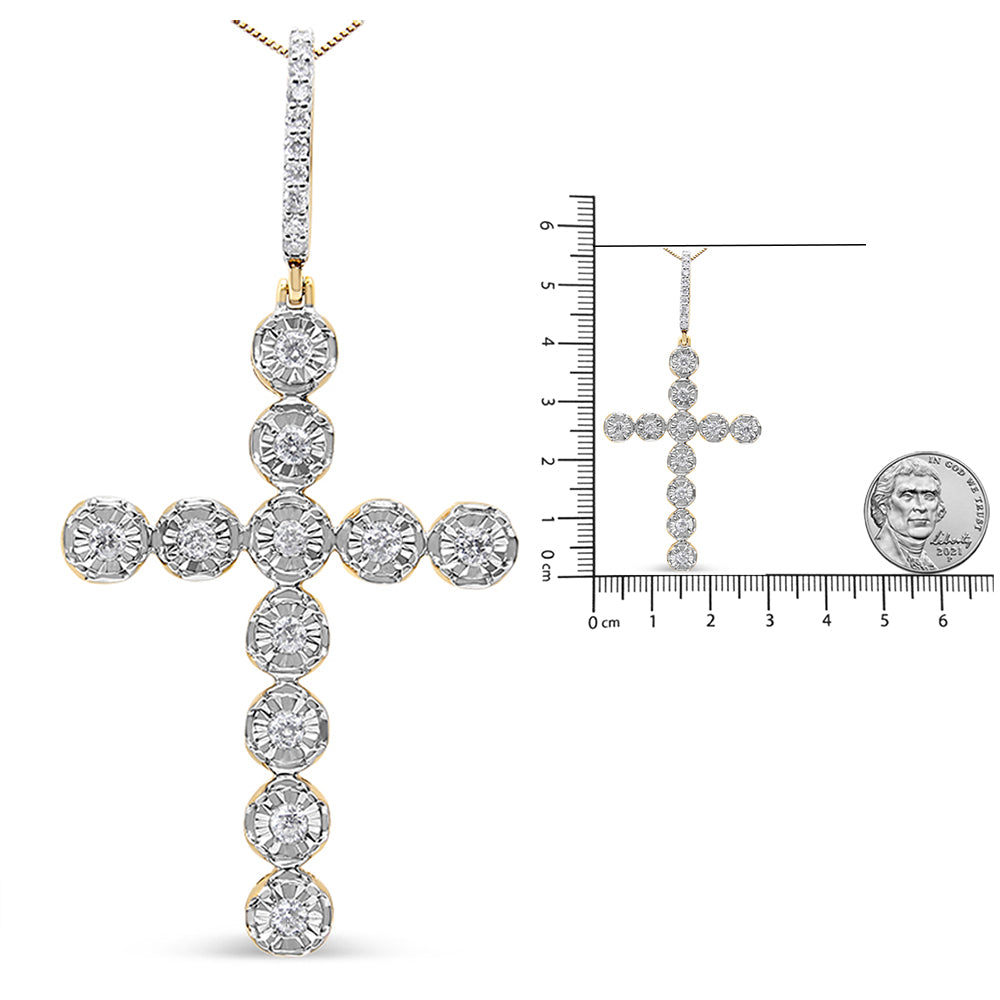 Front view of a yellow metal cross-shaped necklace pendant with round white gemstones in prong settings, shown alongside a size reference ruler and a coin.